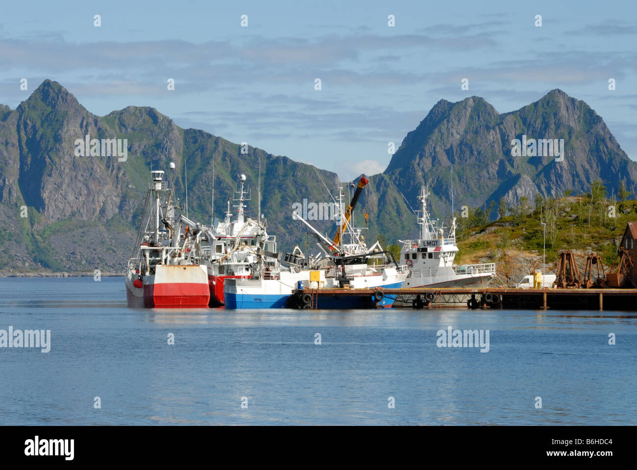 Trawlers in Henningsvaer harbour Stock Photo