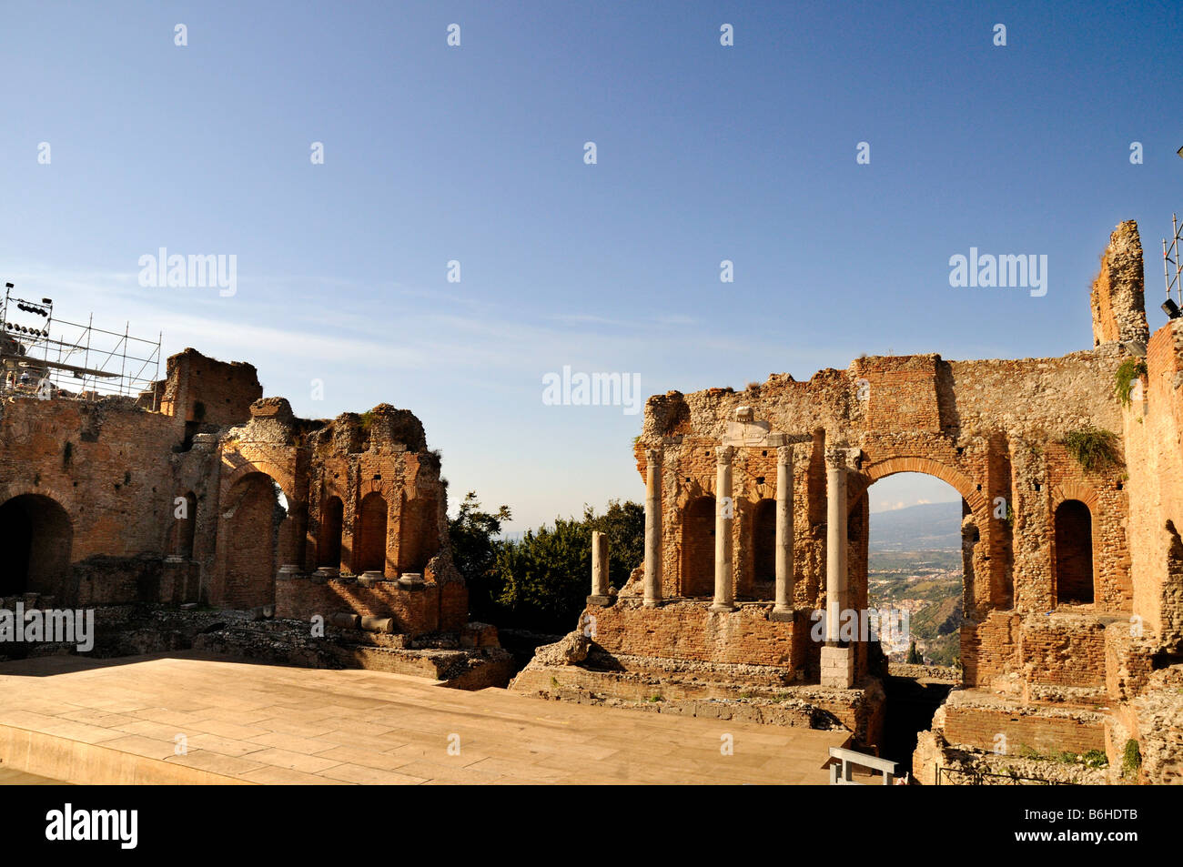The Ancient Greek Theatre with Mount Etna behind in Taormina in Sicily