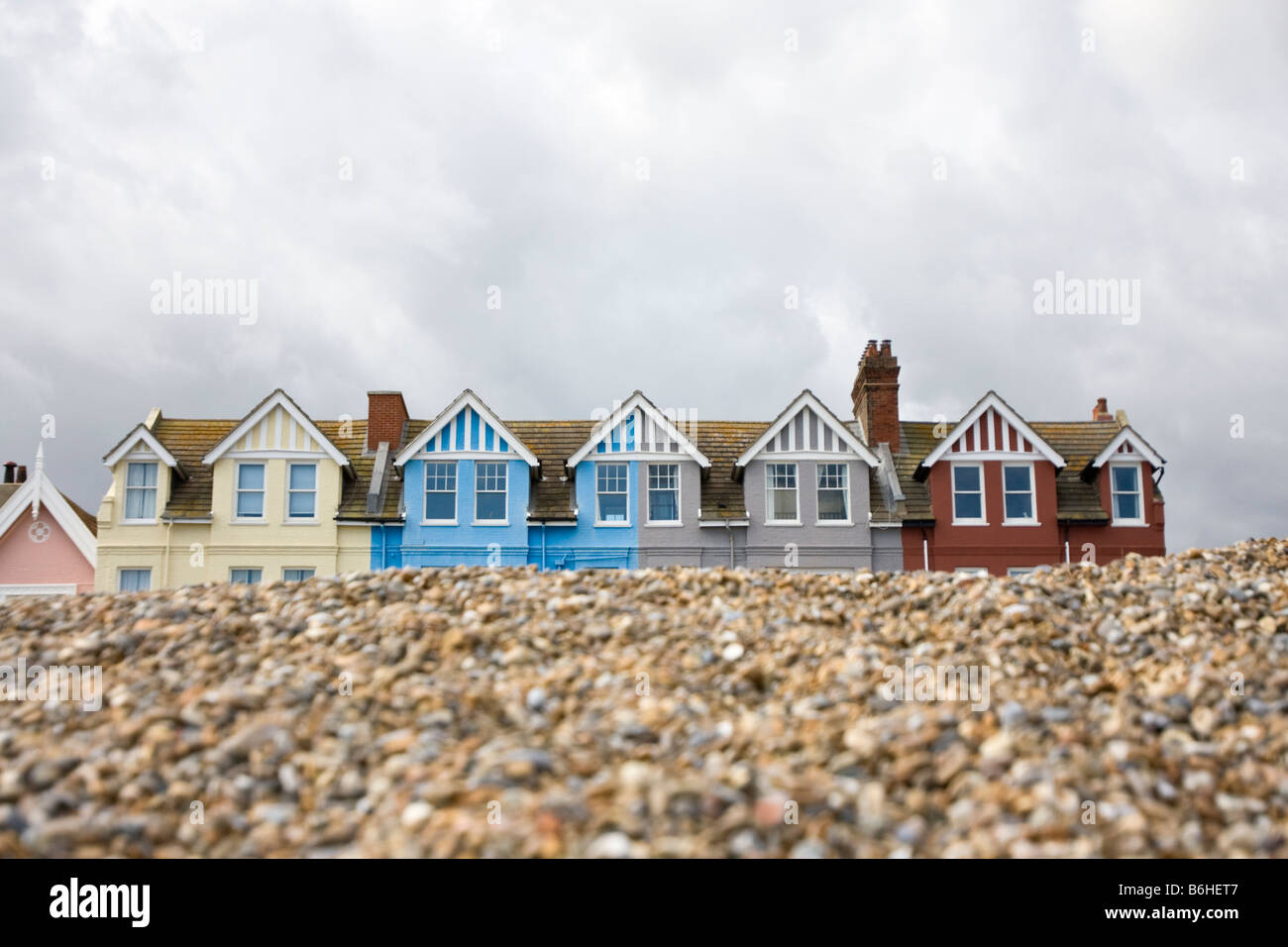Roofs of houses behind the shingle of Aldeburgh beach Stock Photo