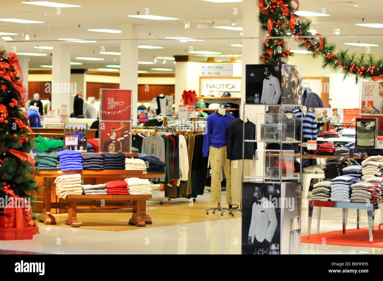 Interior view of clothing racks and merchandise in  Macys department store without people. Stock Photo