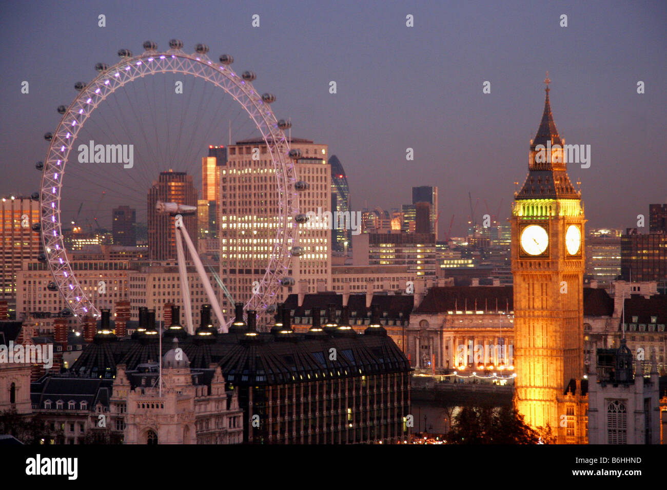 Big Ben and the London Eye illuminated at night London UK Stock Photo