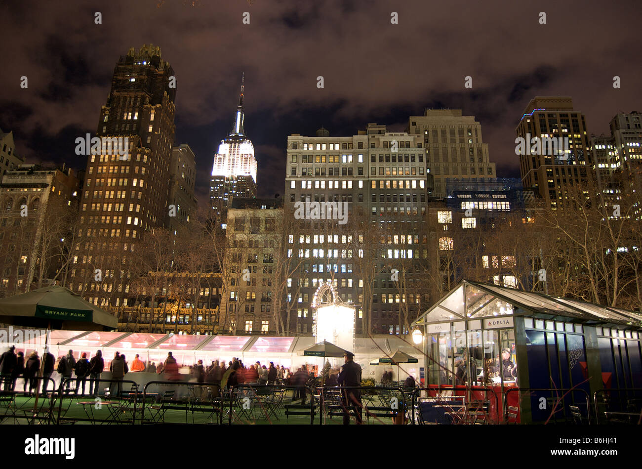 Nighttime Skyline View of Skyscrapers in New York, taken from Bryant Park in Winter Stock Photo