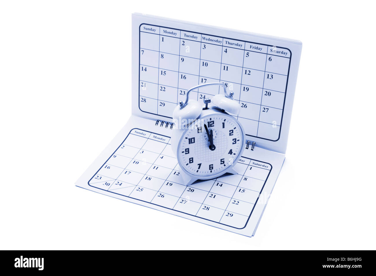 Alarm Clock on Calendar Stock Photo