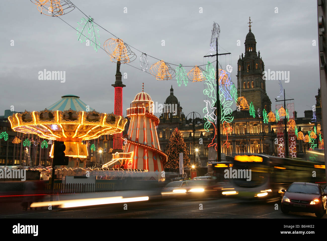 City of Glasgow, Scotland. Christmas dusk view of evening rush hour traffic at George Square. Stock Photo