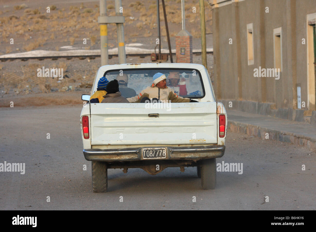 Children Being Transported In Bed Of Old Ford Pickup Truck