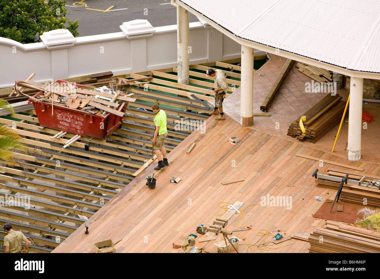 looking down on construction workers as they install a new external