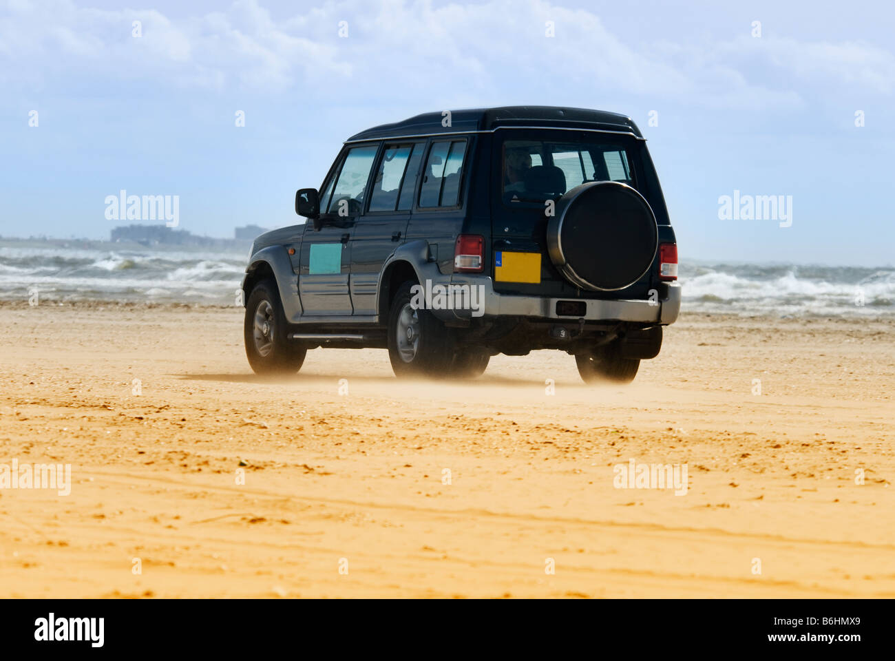 car driving on the beach Stock Photo