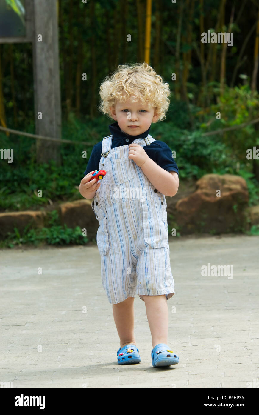 cute young boy walking in summer Stock Photo