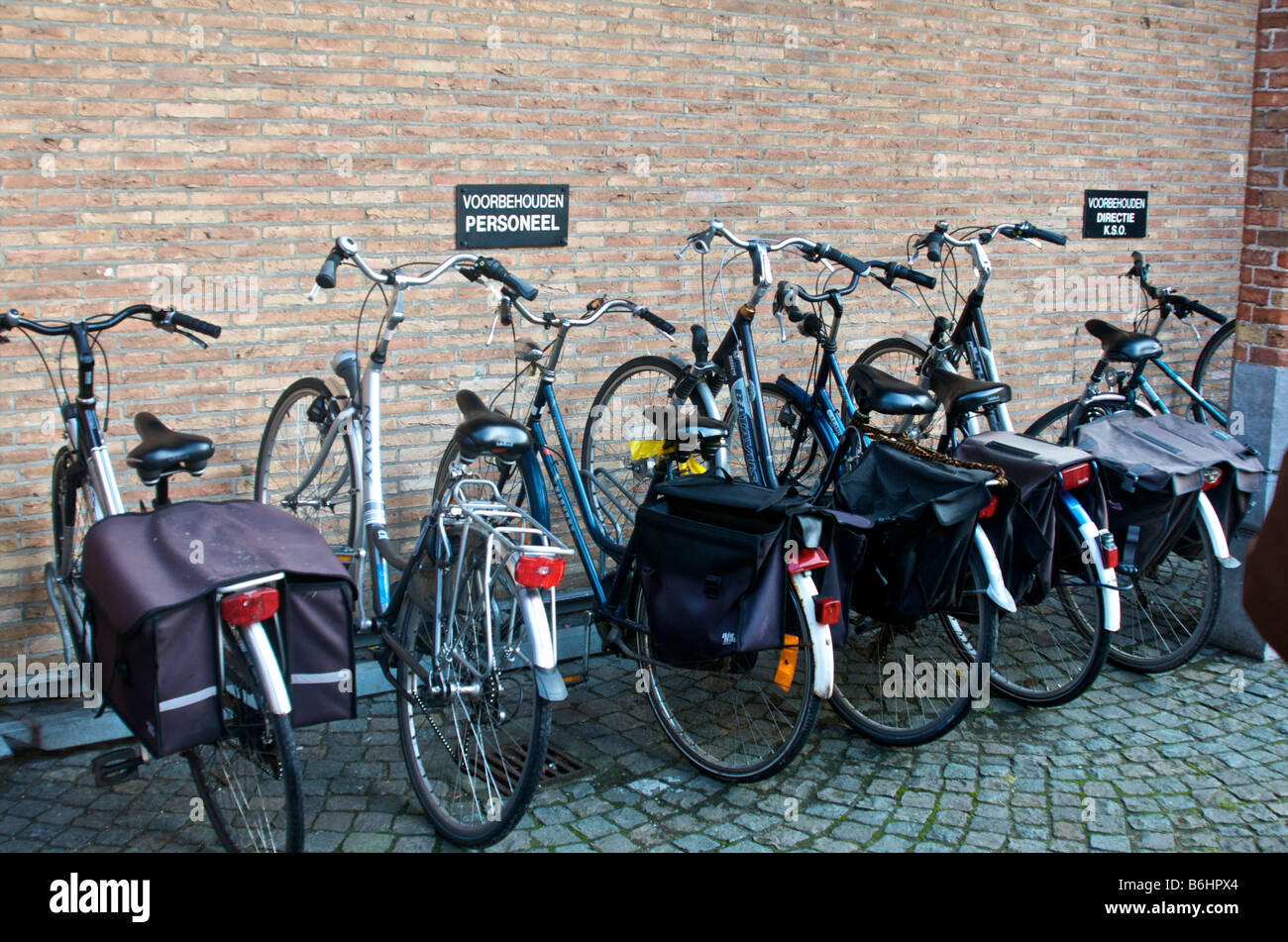 Bikes in an art school, with the sign above for Employees only Stock Photo