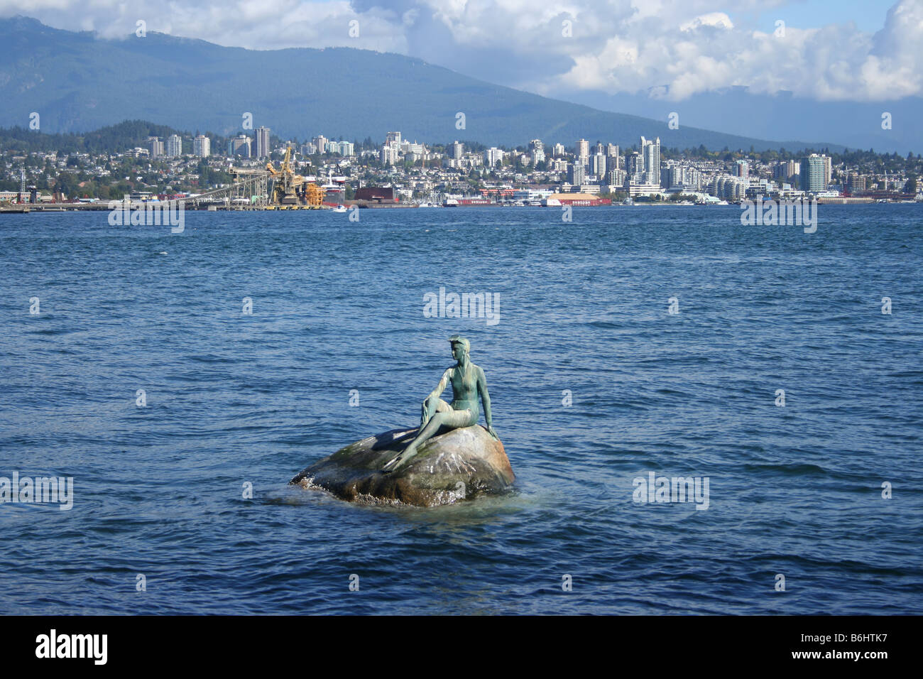 Lady in a wetsuit statue with north Vancouver skyline October 2006