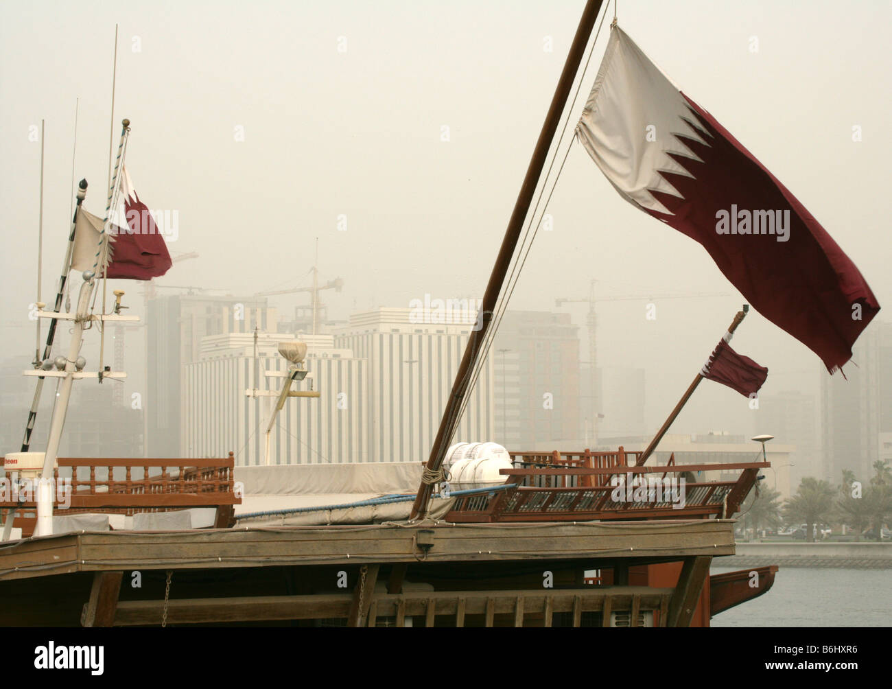 Qatari flags decorating traditional boats at Doha Bay, Qatar Stock Photo