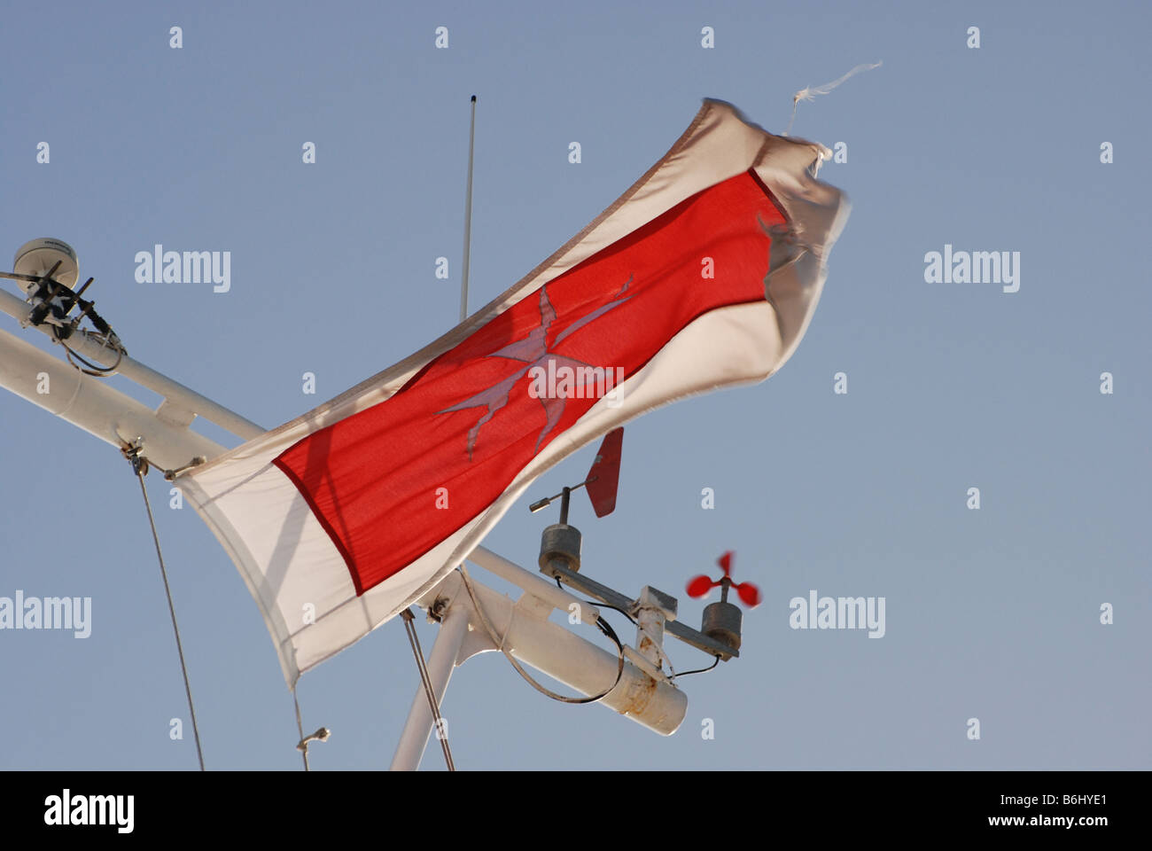 Maltese Flag blowing in the wind on the Malta to Gozo Ferry Stock Photo