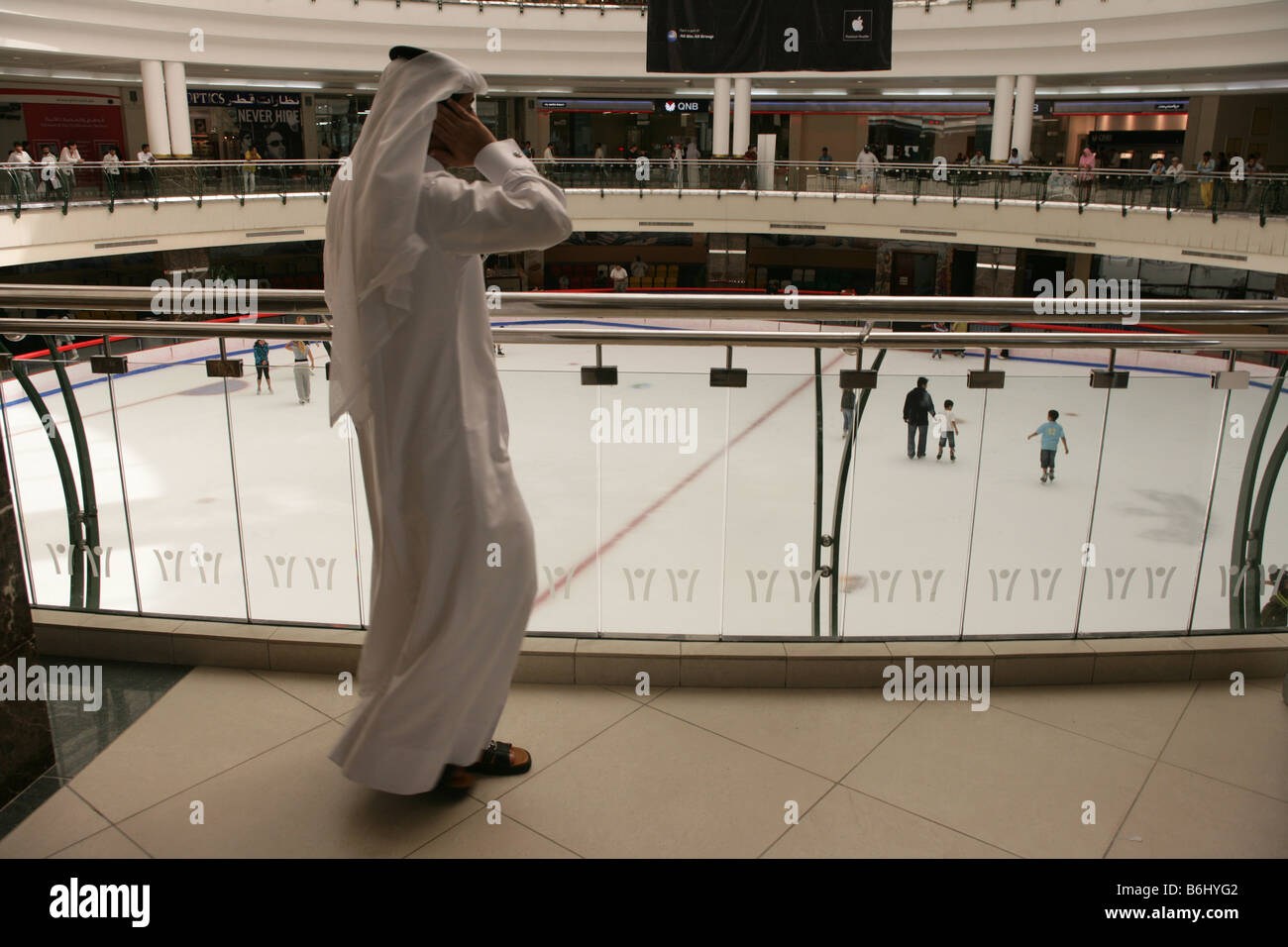 Man in traditional attire at the City Center Mall ice rink in Doha, Qatar. Stock Photo