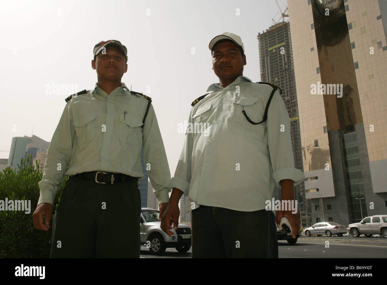 Immigrants working as security guards in Doha, Qatar Stock Photo Alamy
