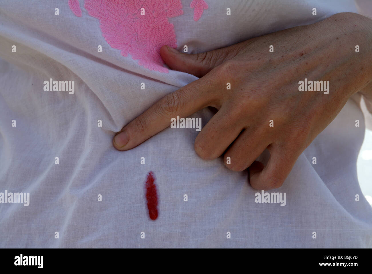 Fruit stain on a woman's top. Stock Photo