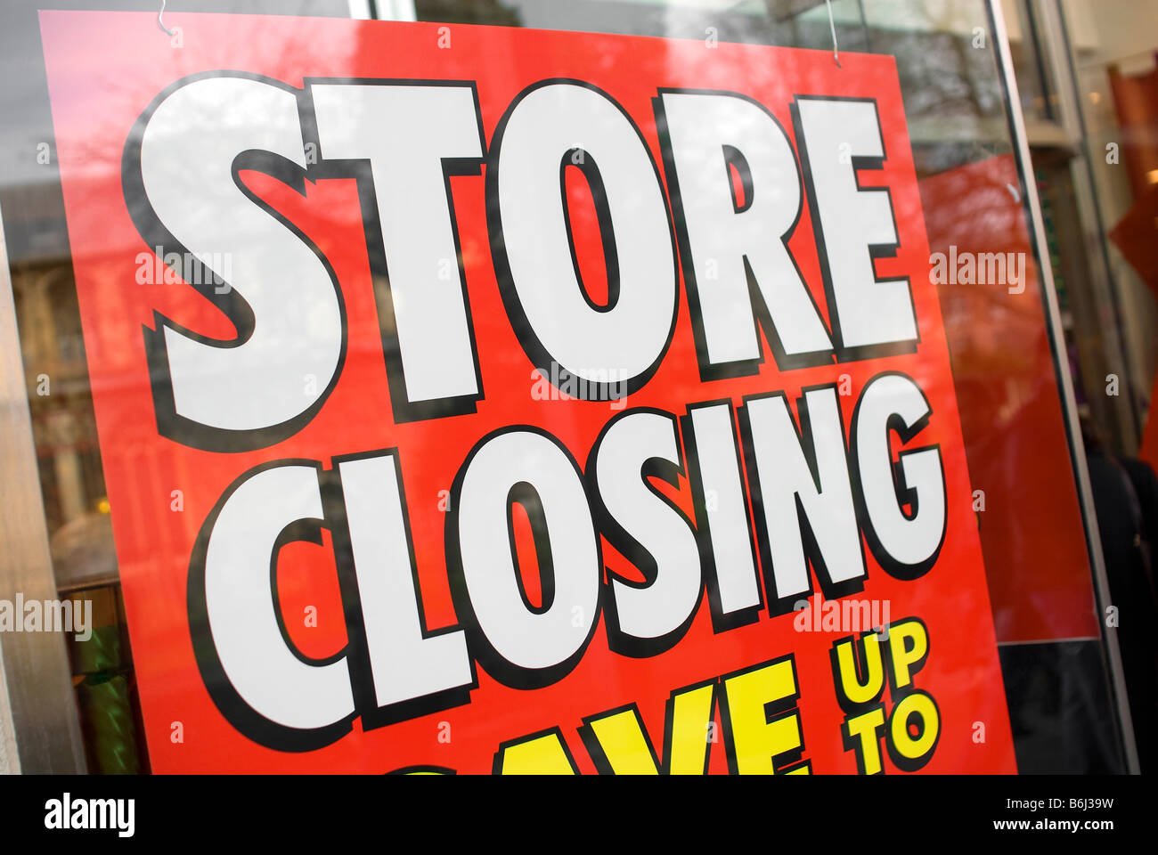 store closing down sale window poster Stock Photo