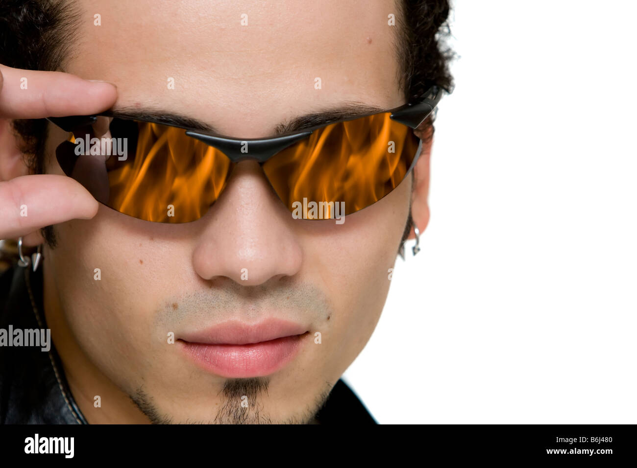 close up portrait of a young guy wearing eyeglasses with a fire