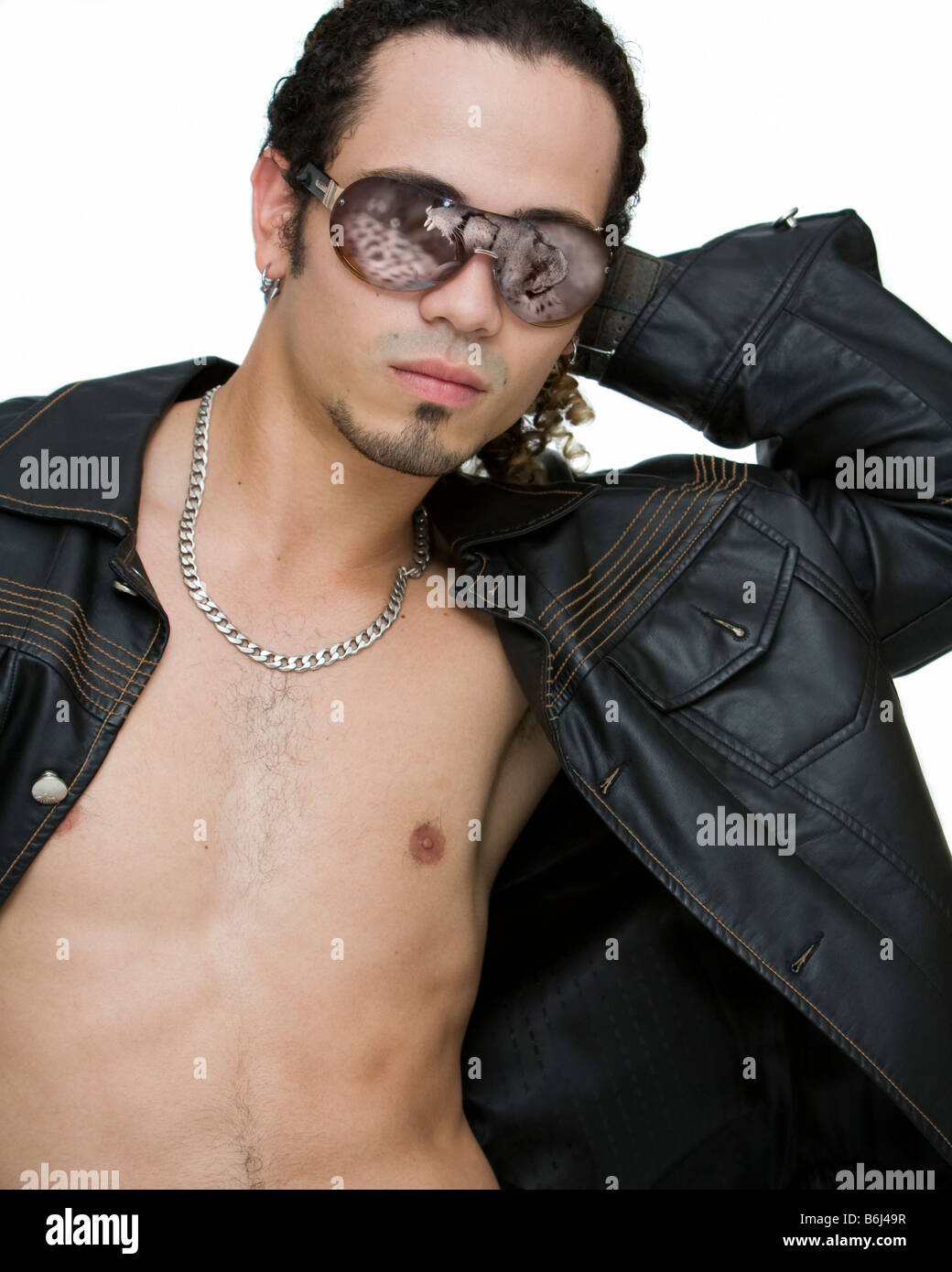 young man modeling sunglasses with a reflection of a cheetah with its mouth open Stock Photo