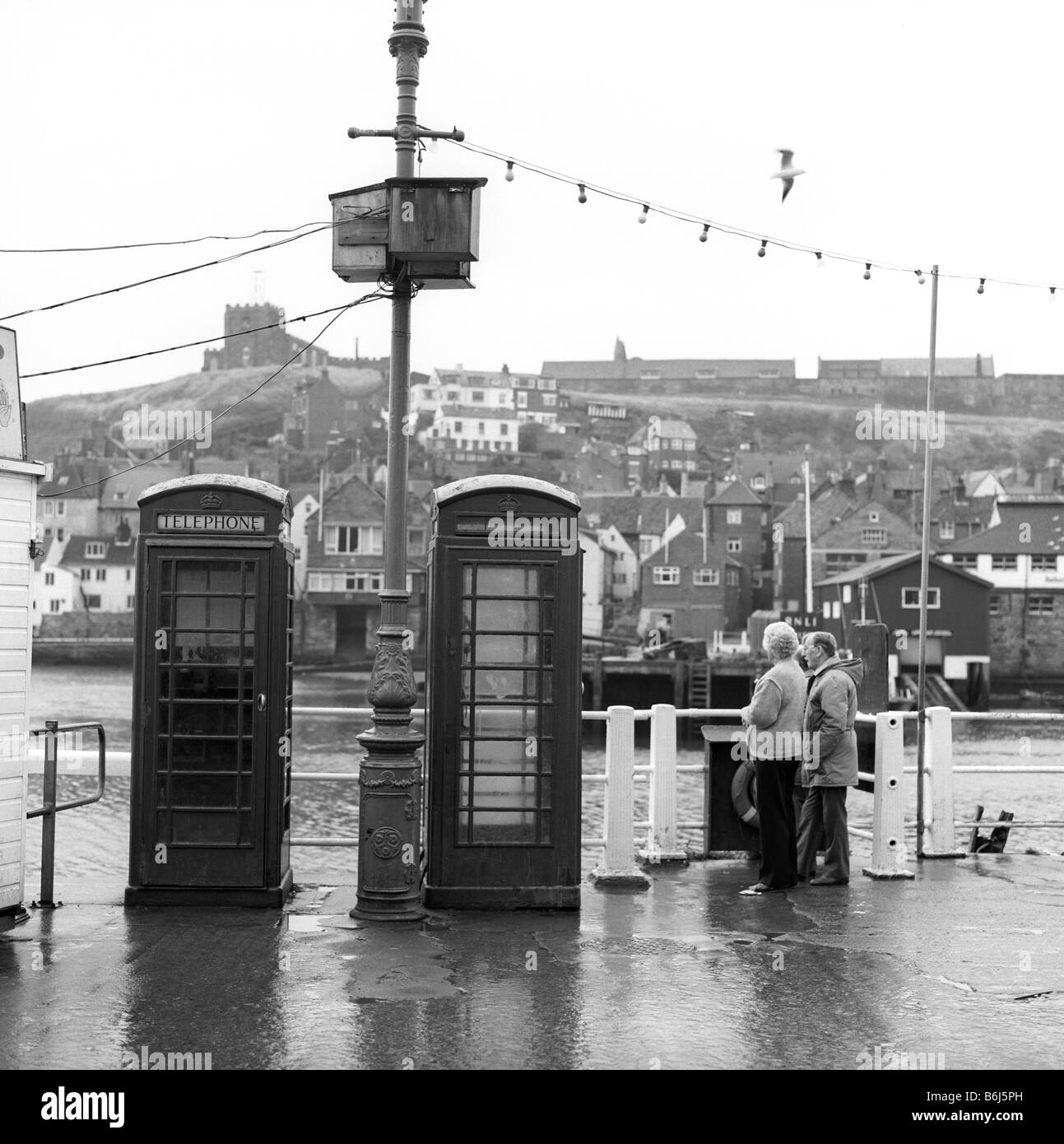 UK England Yorkshire Whitby quayside K6 phone boxes Stock Photo