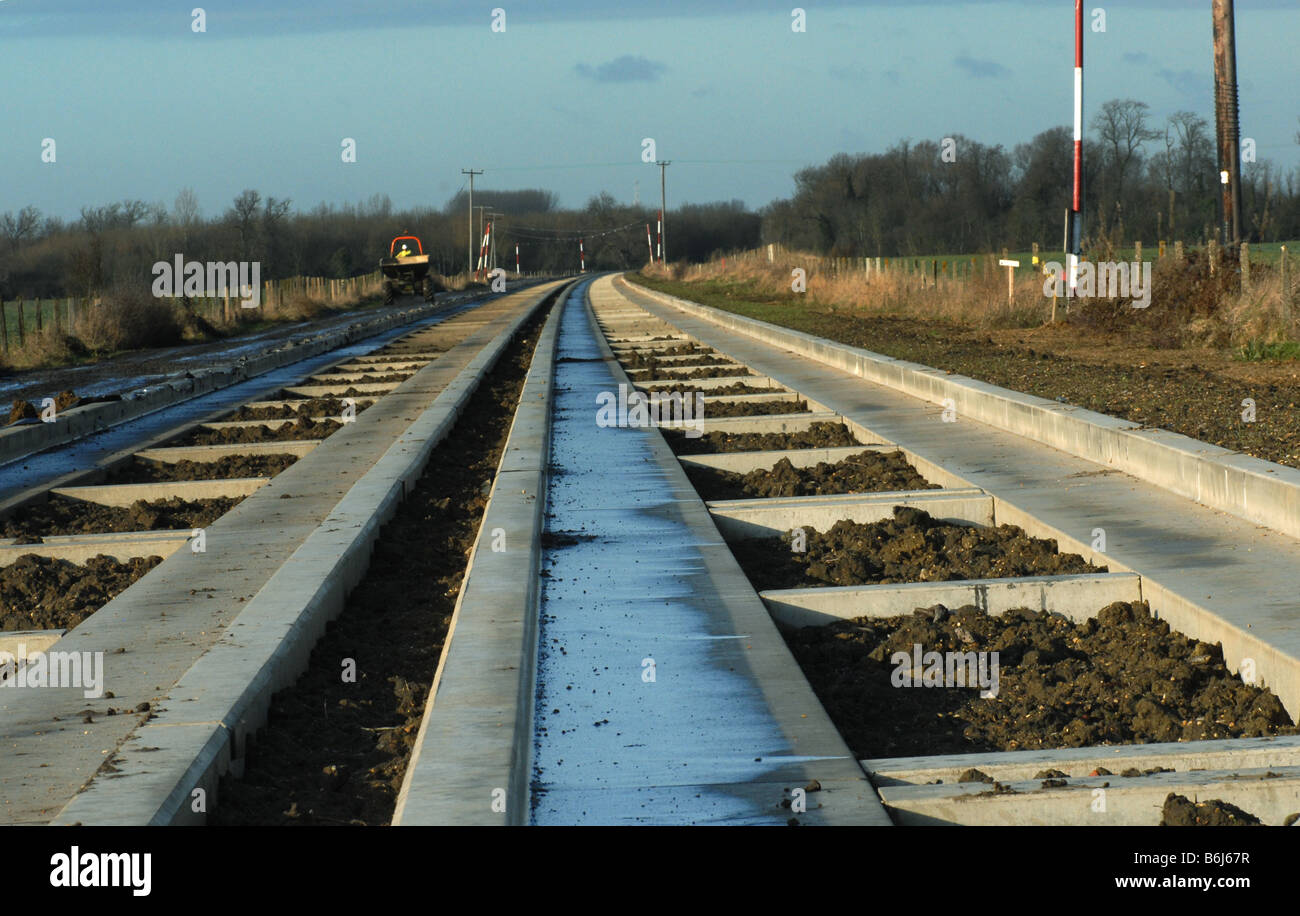 Topsoil being placed to fill in the space between the tracks on the Cambridgeshire Guided Busway project Stock Photo