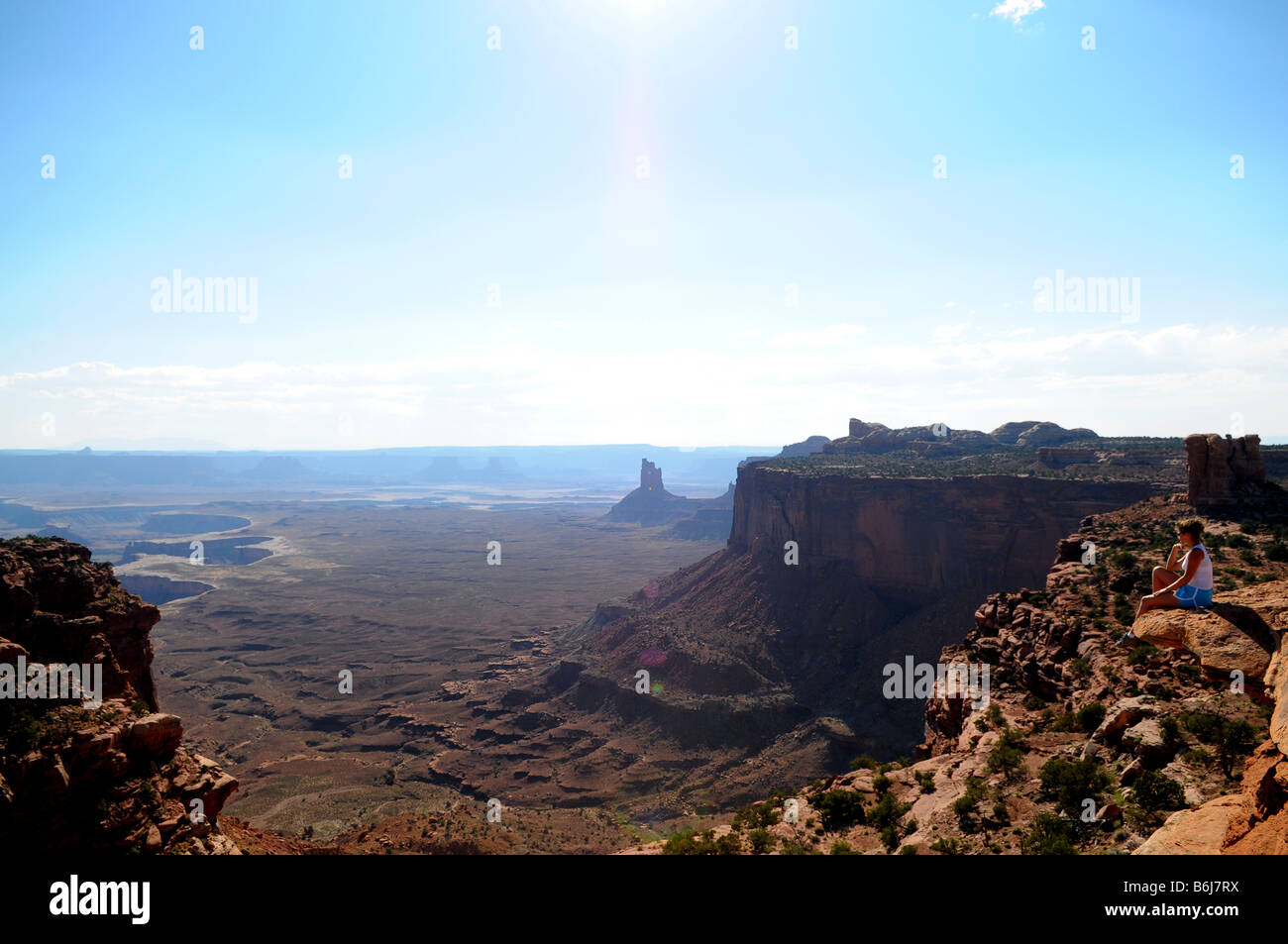Girl Sitting at the edge of the cliff Stock Photo - Alamy