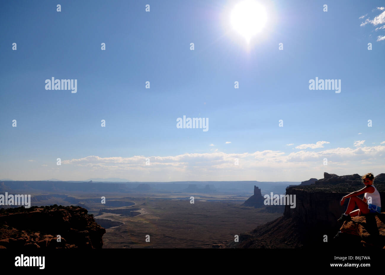 Girl Sitting at the edge of the cliff Stock Photo - Alamy