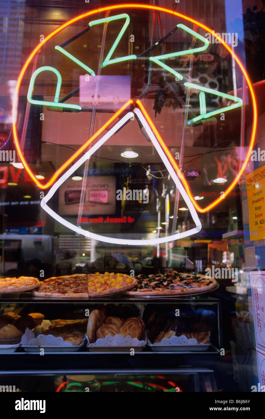 New York City Broadway and Times Square neon pizza sign on an Italian food restaurant window USA. Stock Photo
