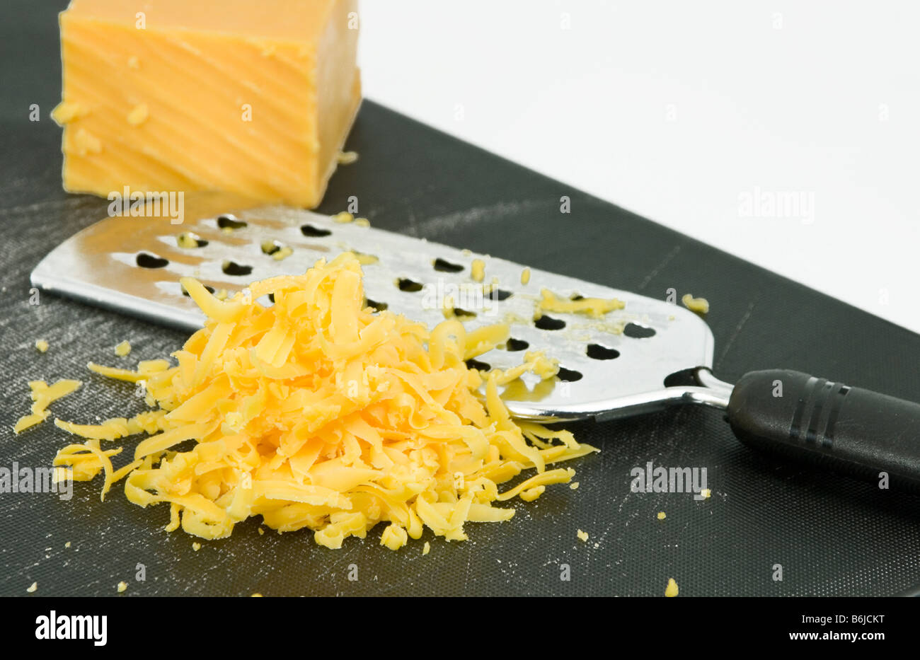 Grated cheddar cheese Stock Photo Alamy