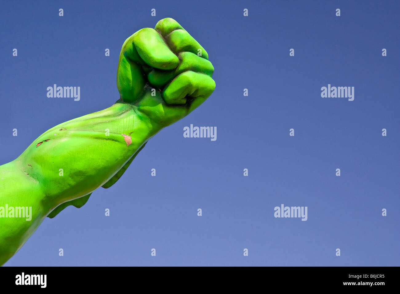 The bright green arm and fist of a giant creature attached to a tourist trap type attraction in Pigeon Forge, Tennessee USA.. Stock Photo