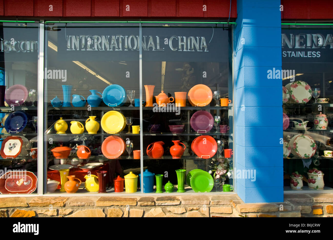Store front of a shop featuring brightly colored Fiesta Ware dishes in