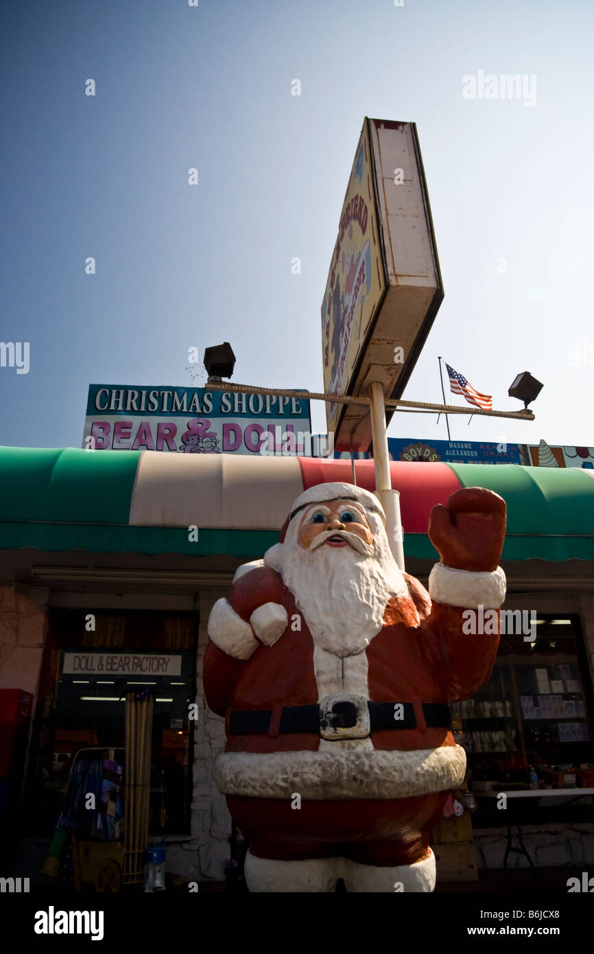 Store front of tacky tourist trap Christmas store featuring a large