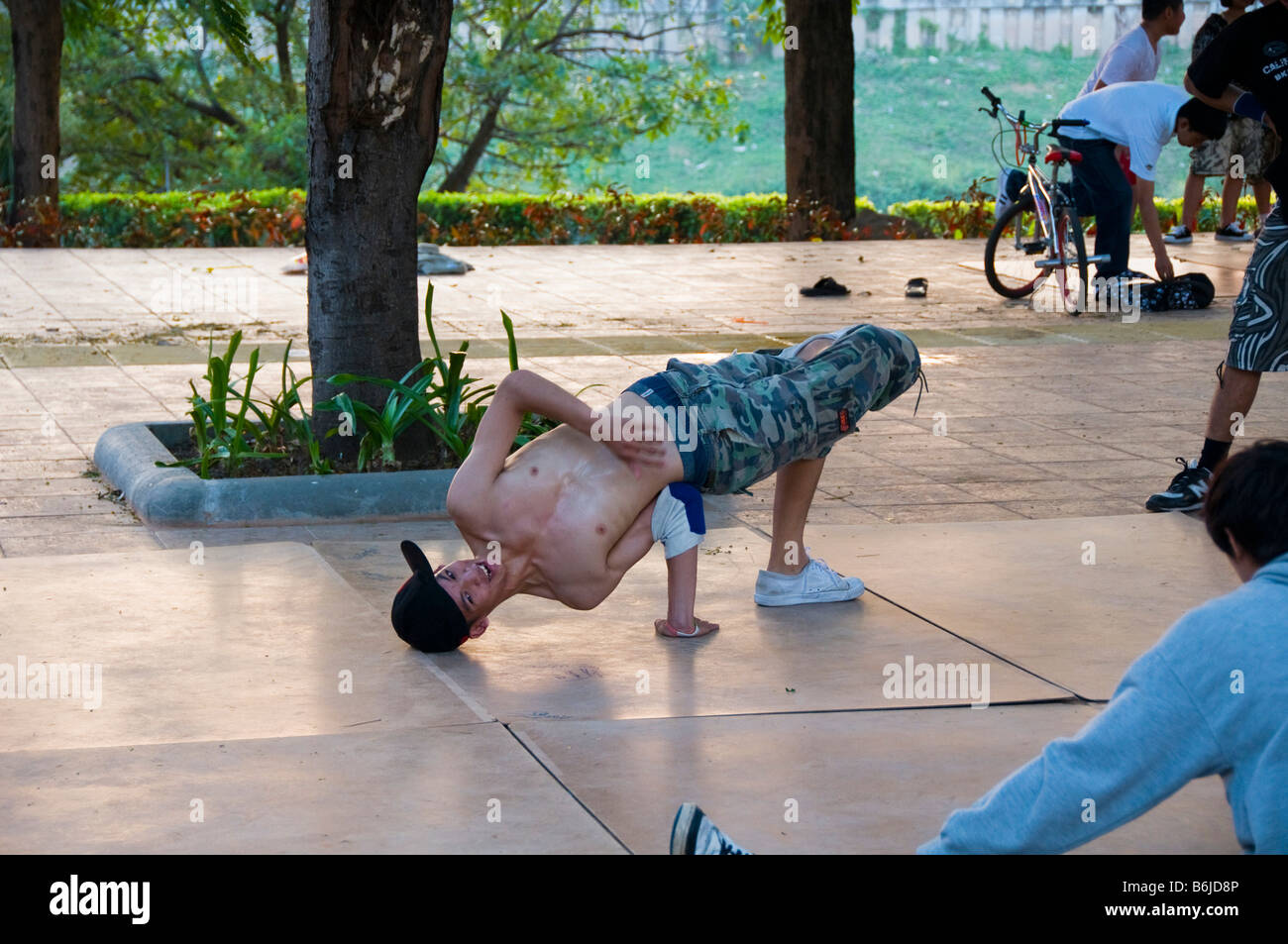 breakdancer practicing his moves in Bangkok Thailand Stock Photo