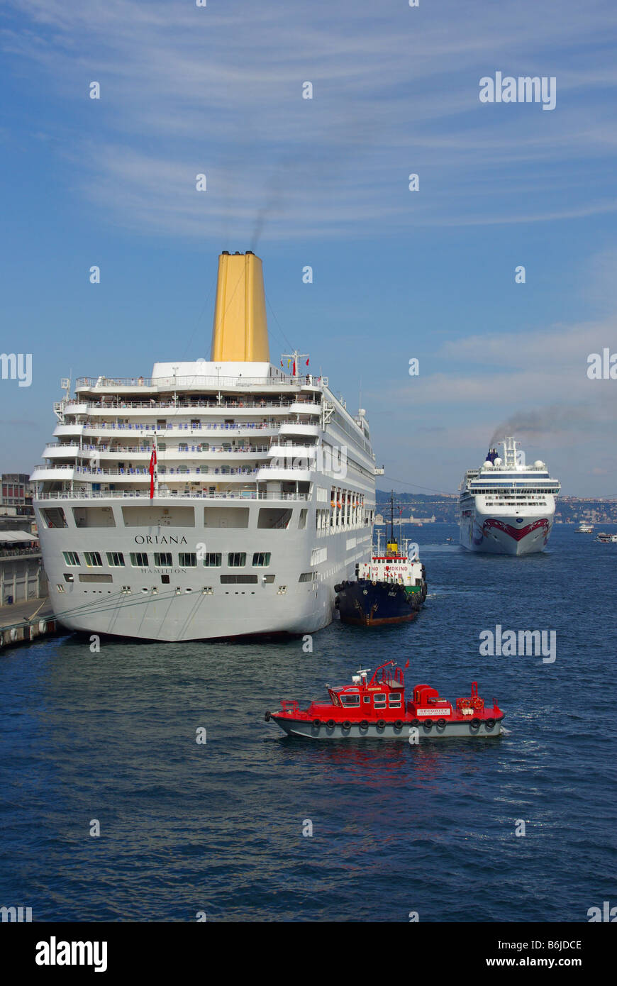 Istanbul Port on Bosporus waterway cruise ship P&O Oriana with red security launch & Norwegian Jewel ocean liner beyond Turkey Europe Stock Photo