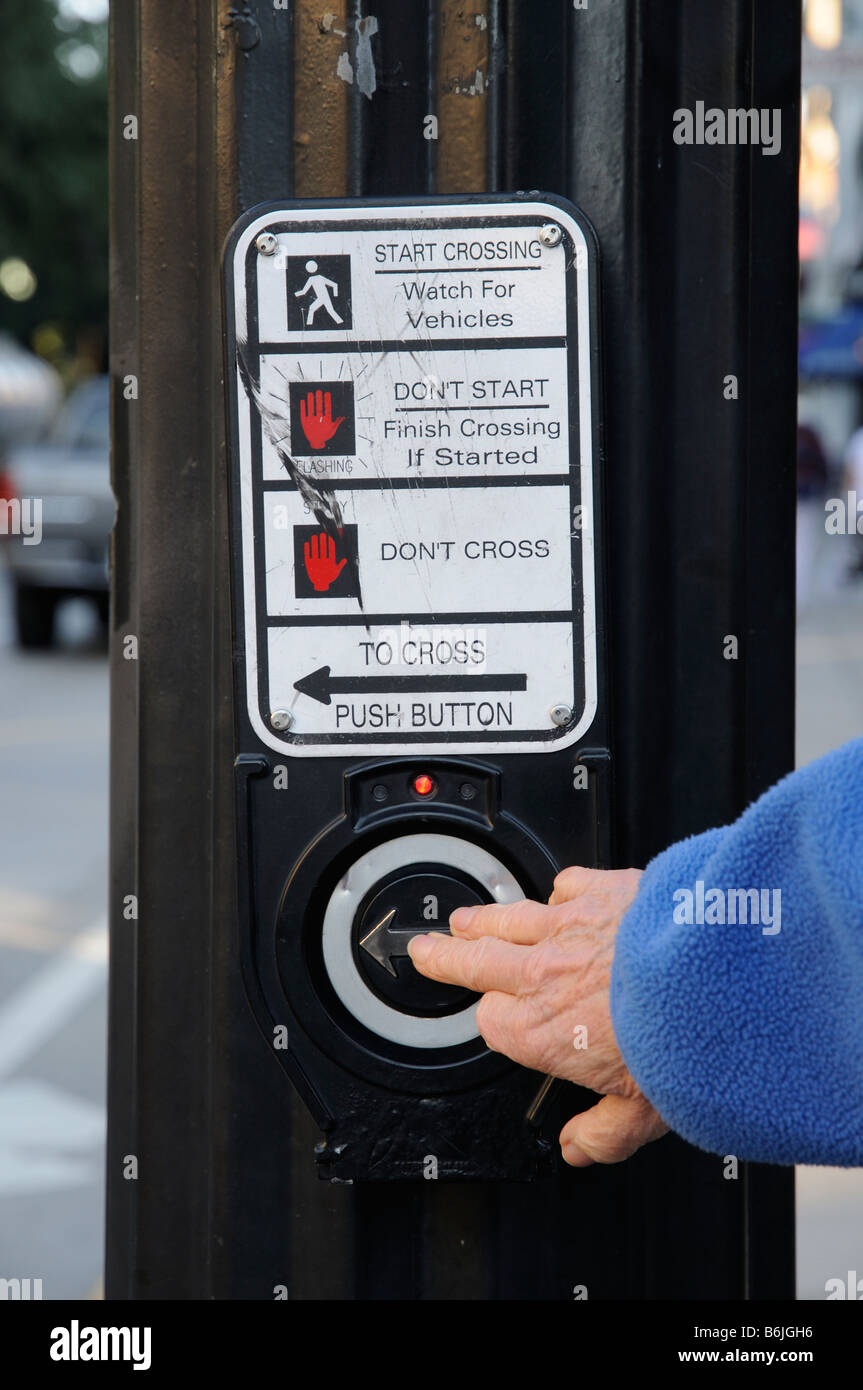Pedestrian crossing control button being activated by pushing a button Stock Photo Alamy