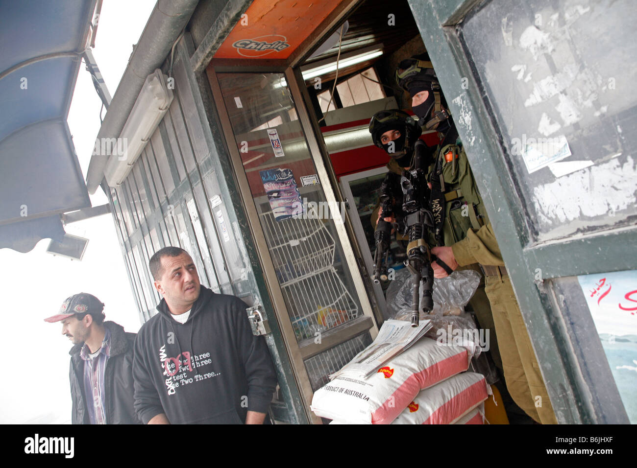 Israeli soldiers inside a Palestinian shop during clashes with