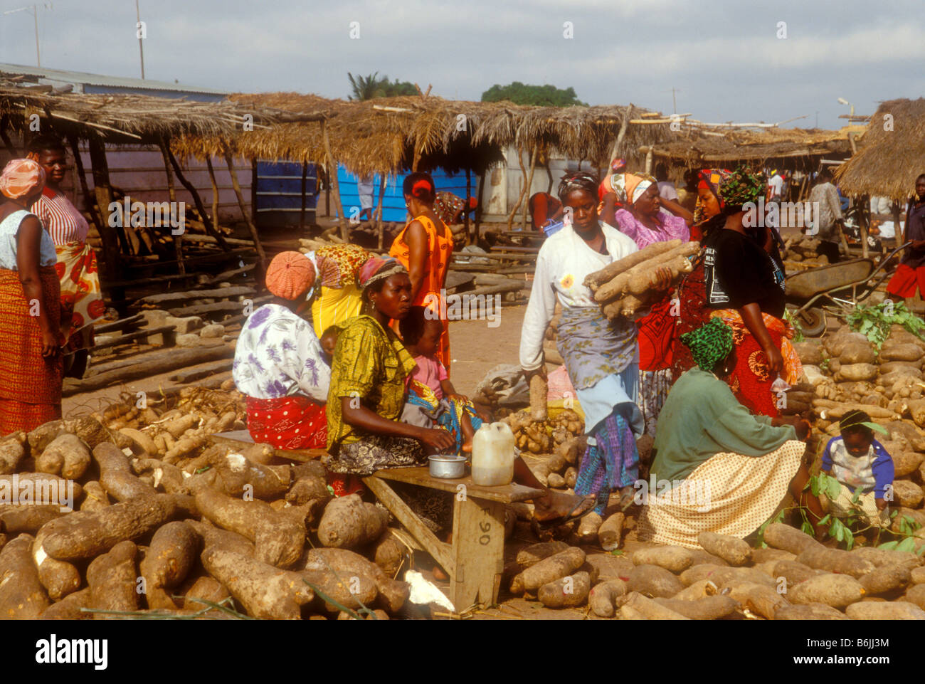 Ghana: Sampa (Brong-Ahafo Region), market scene with women selling yams ...