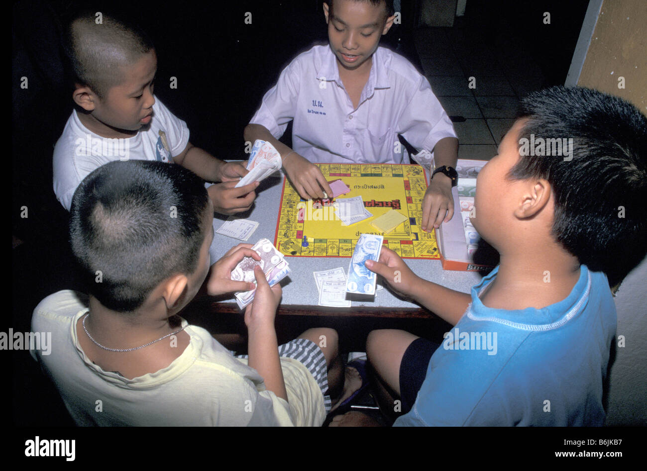 Asia, Thailand, Bangkok, Boys play a Thai version of Monopoly game Stock  Photo - Alamy