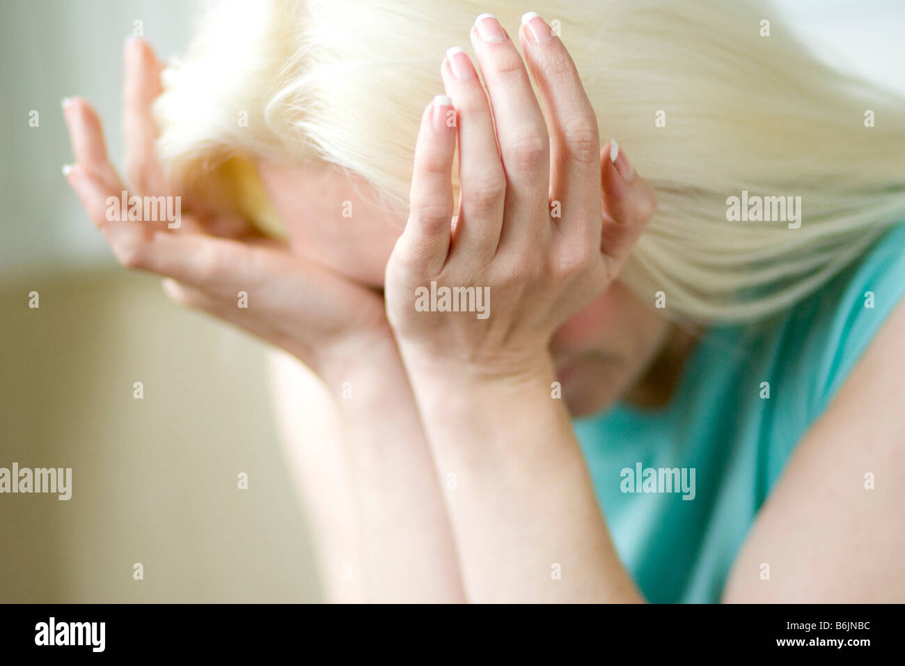 Girl rubbing eyes Stock Photo