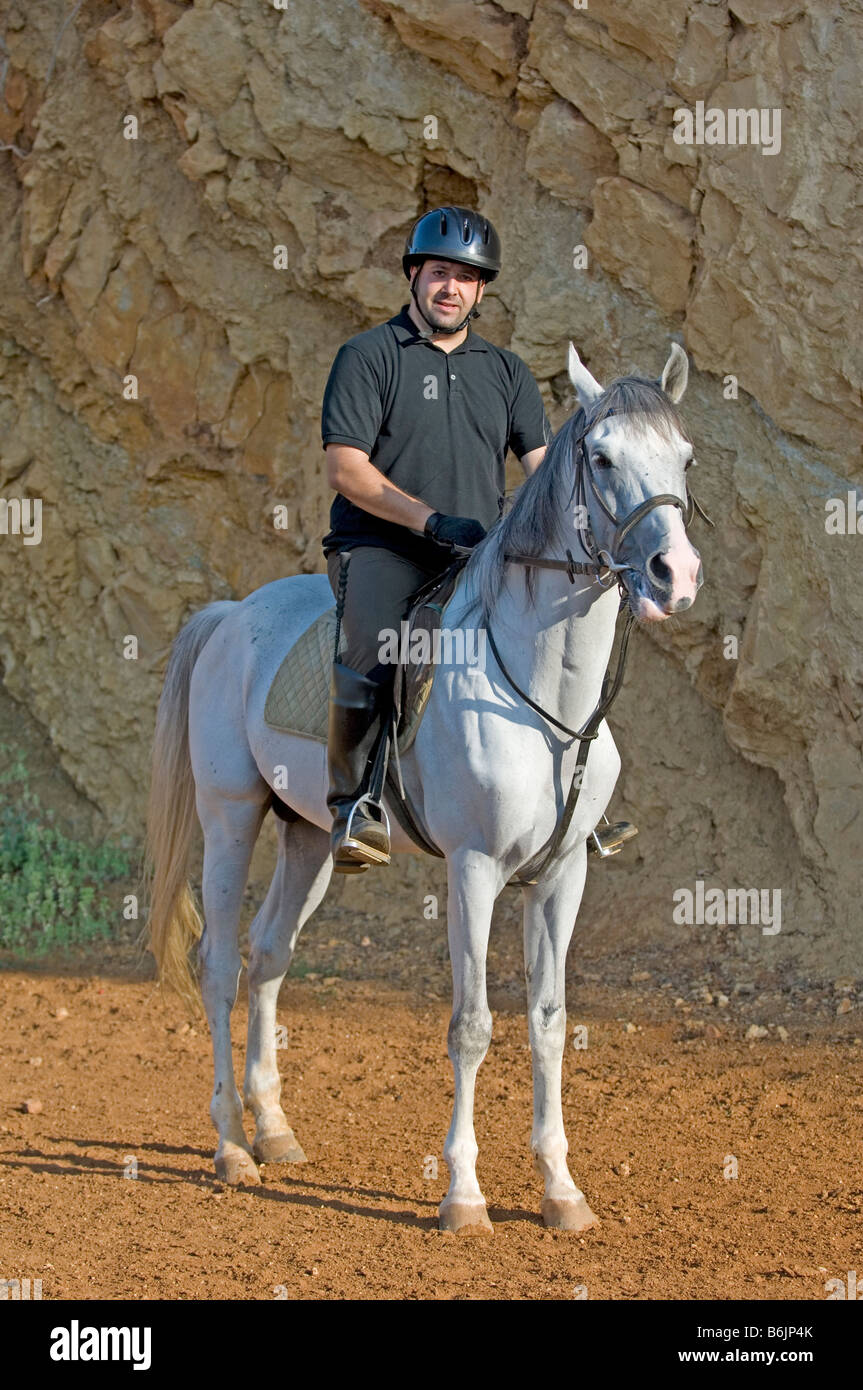 Man riding a horse Stock Photo