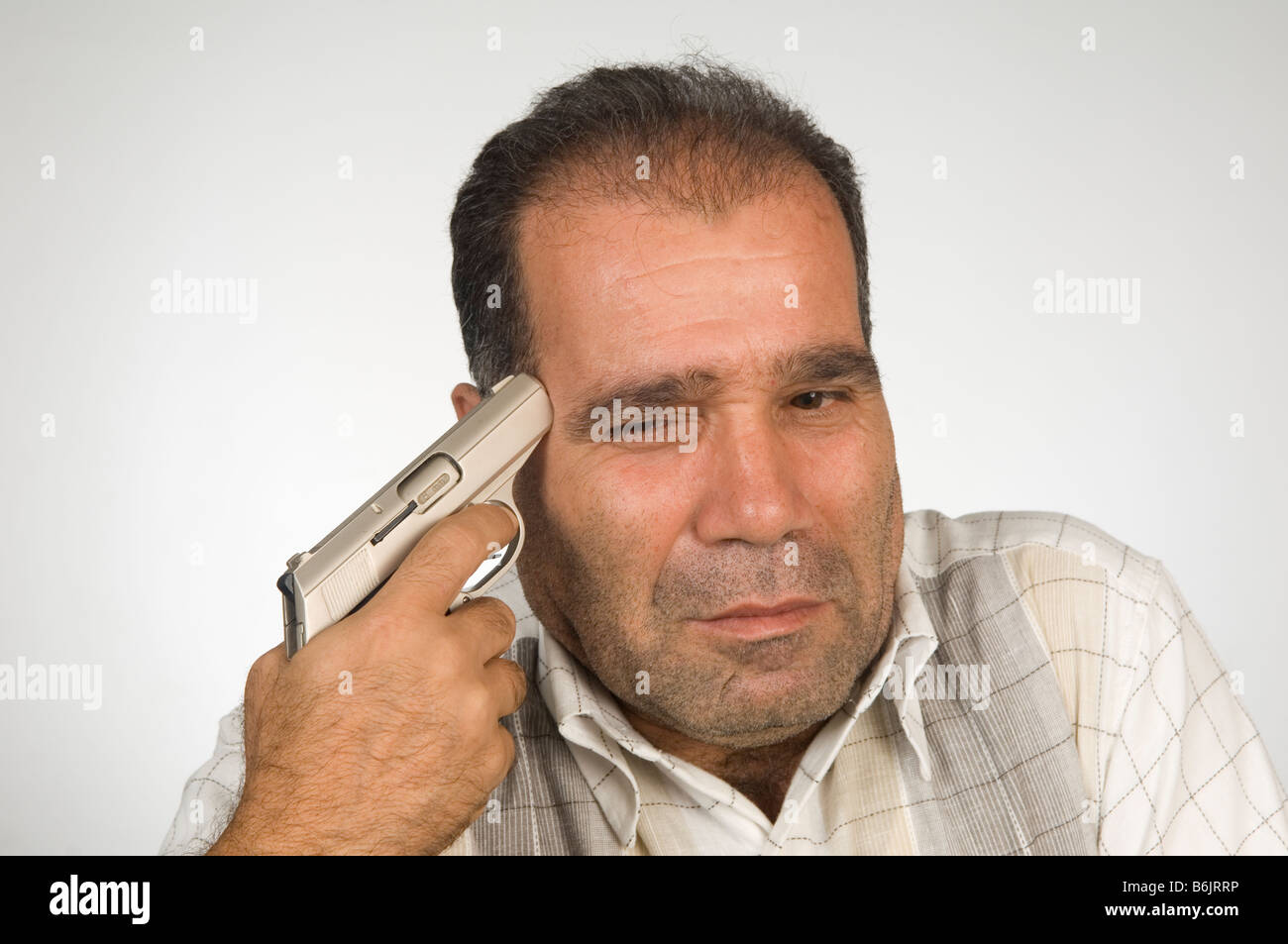 Man holding gun to his head Stock Photo Alamy