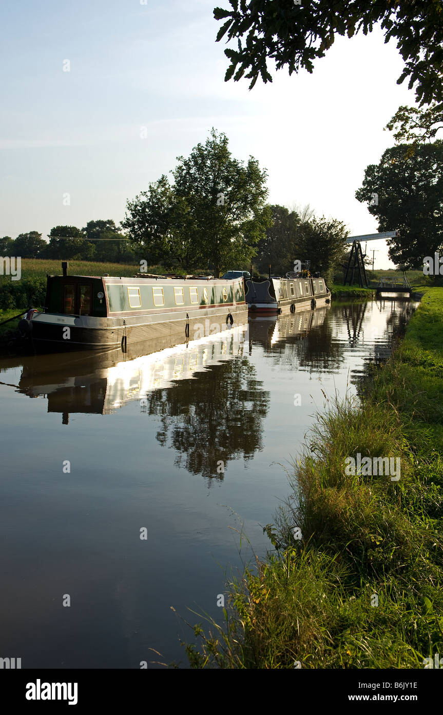 England, Shropshire, Whitchurch. Barges on a tranquil section of the Shropshire Union Canal