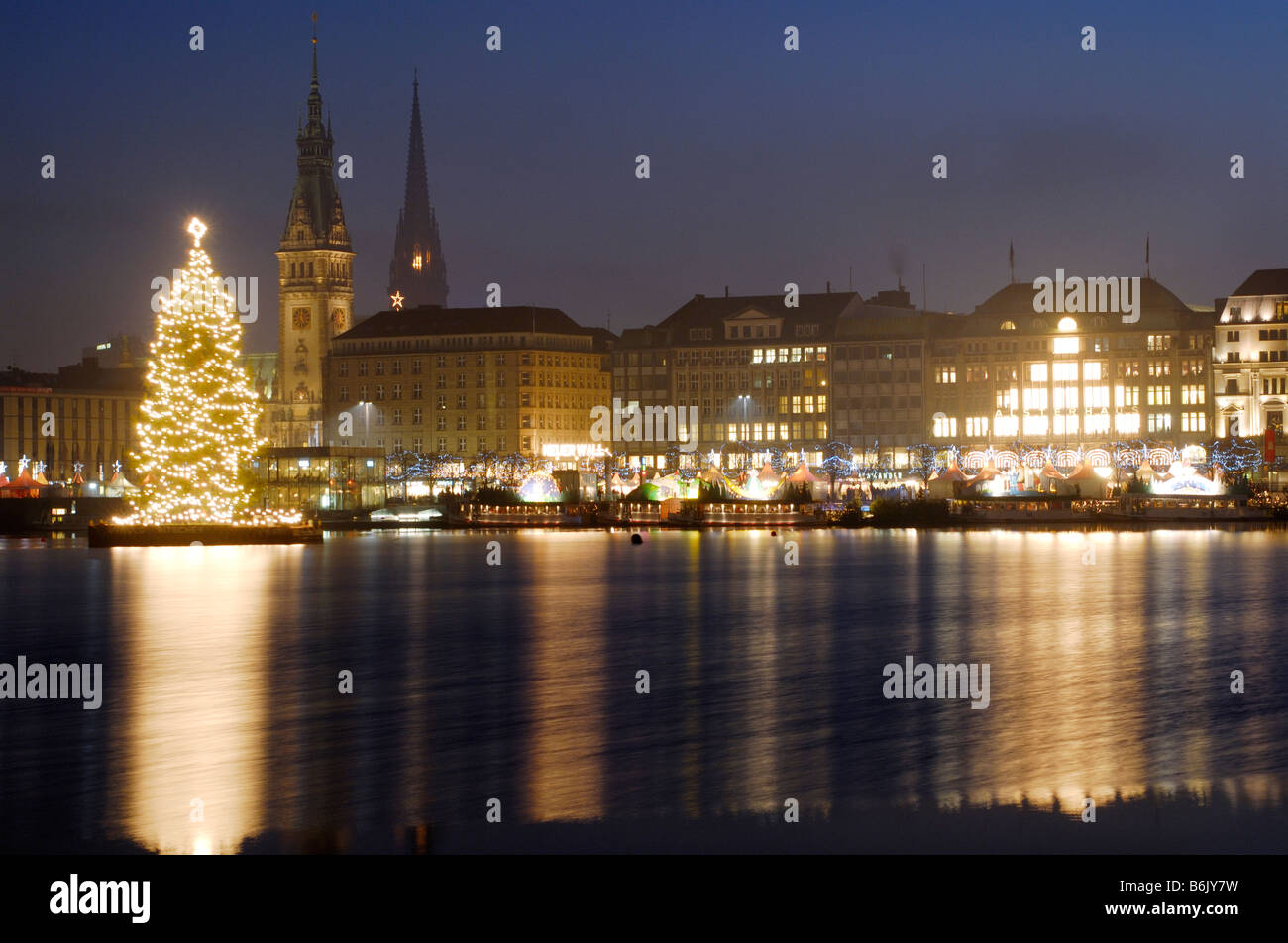 The illuminated fir tree on the Alster in Hamburg, Germany during