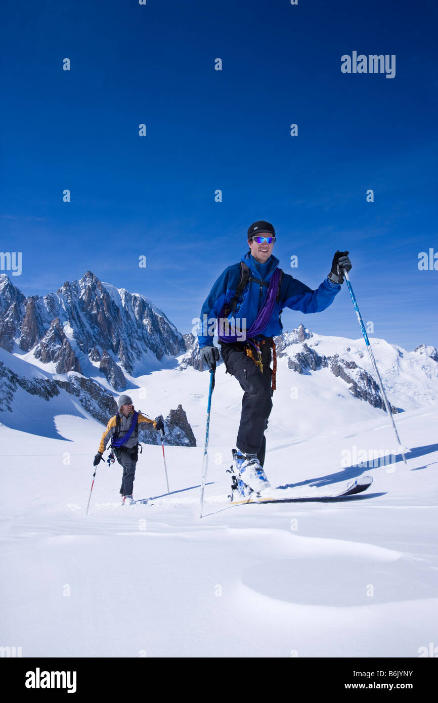 Ski touring on the Glacier du Geant with the Aguille du Midi in the ...
