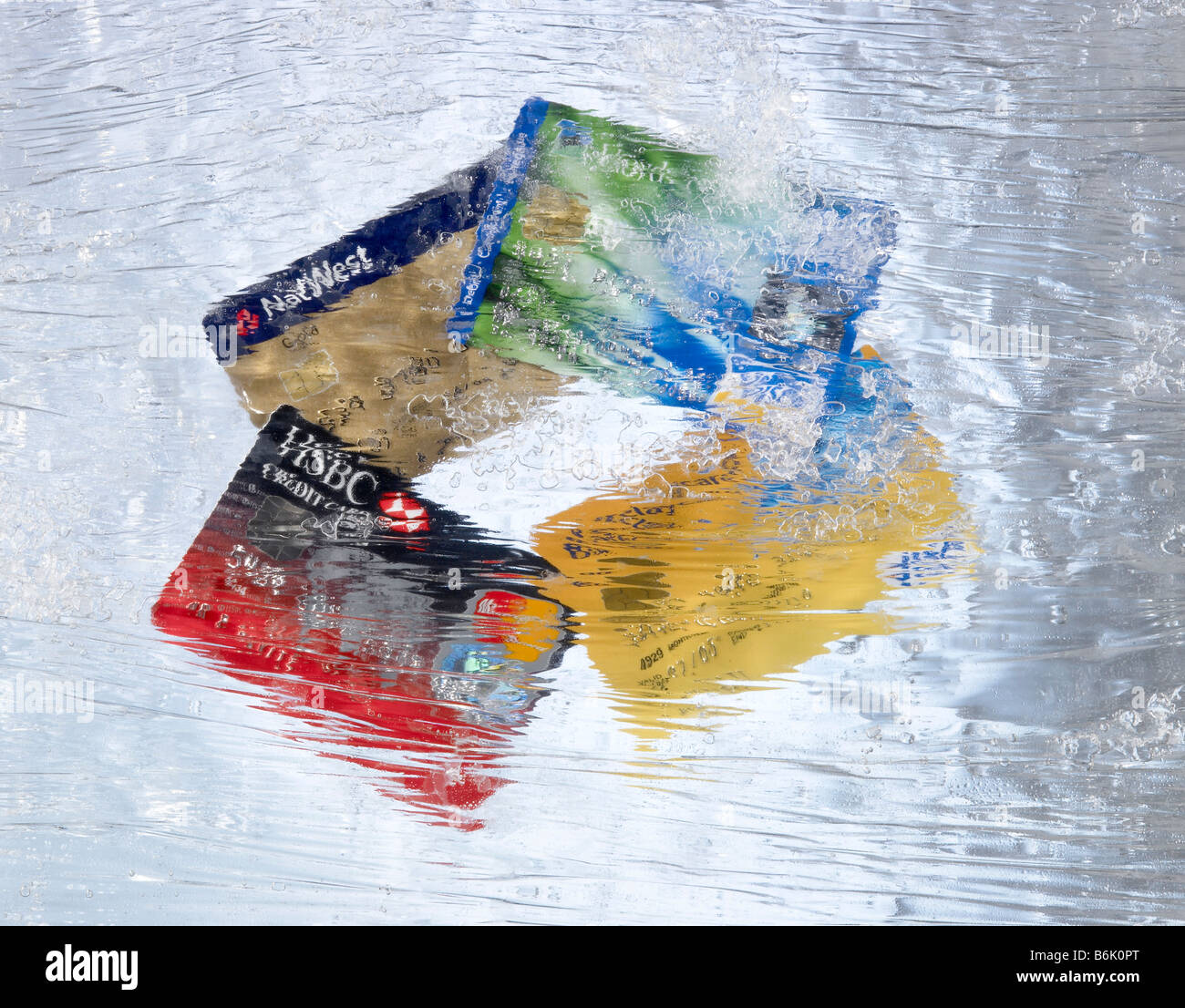Credit Cards Frozen in Ice Stock Photo