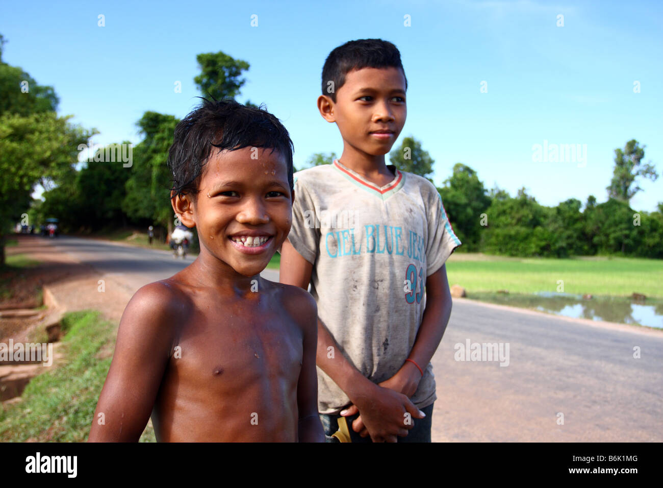 Portrait of a local Cambodian kid with an happy face in the streets arond Angkor Wat, Siem Reap Cambodia Stock Photo
