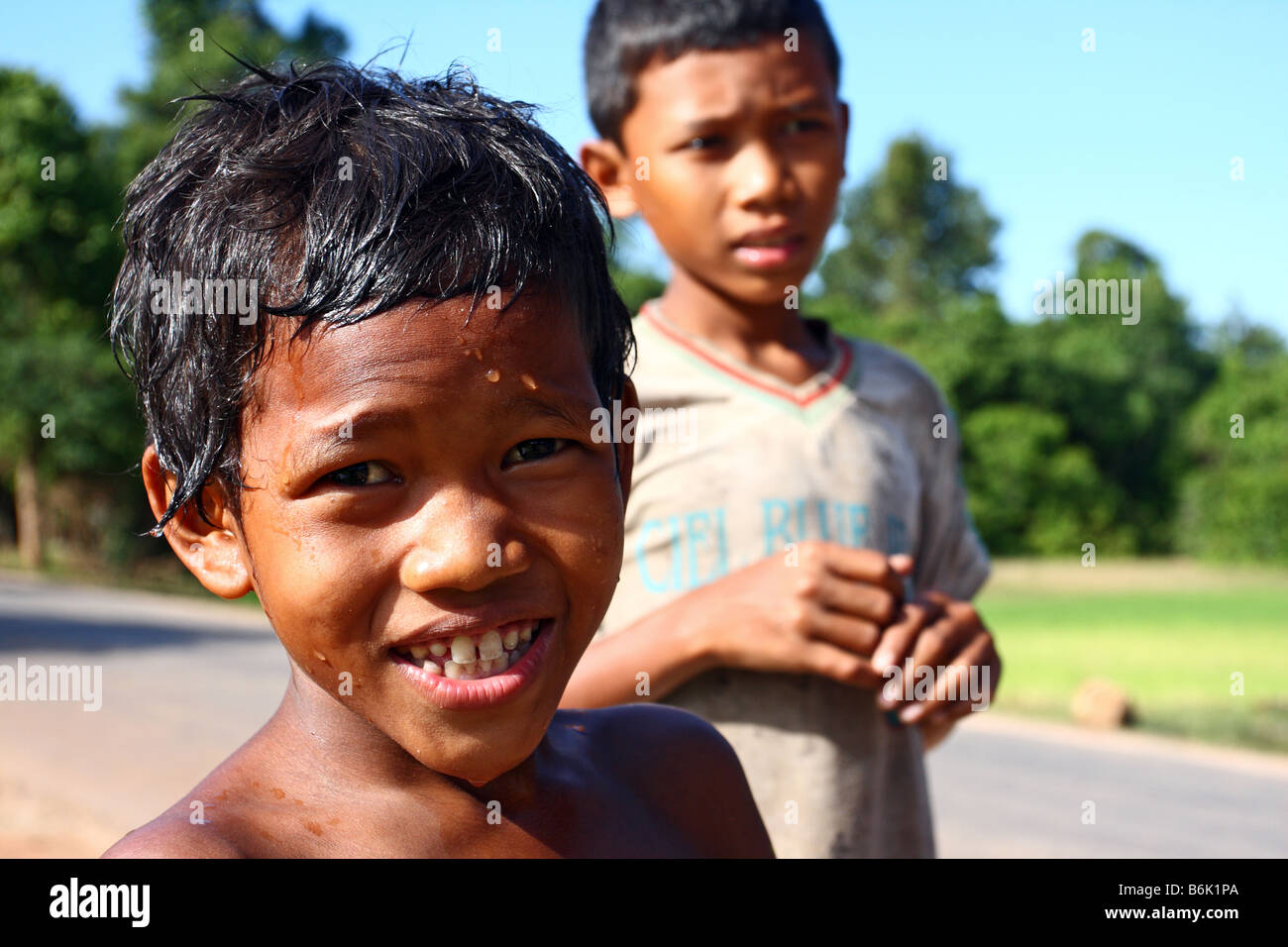 Portrait of a local Cambodian kid with an happy face in the streets arond Angkor Wat, Siem Reap Cambodia Stock Photo