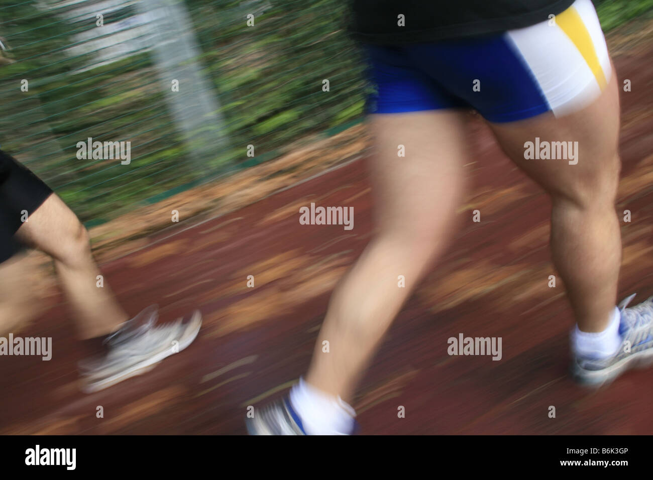 runners in action on country lane in road race Stock Photo Alamy