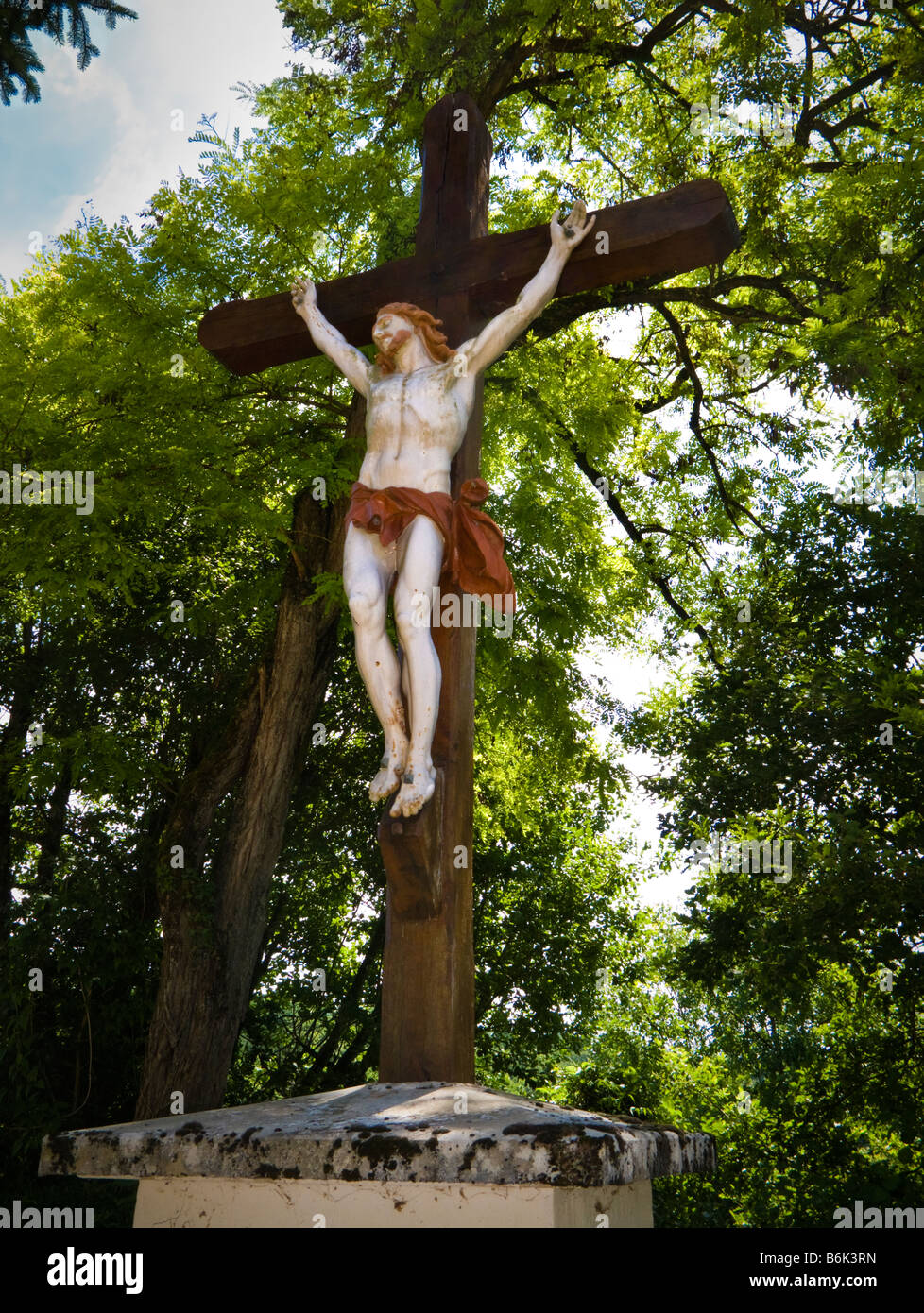 Large statue of Jesus Christ on the cross outside a church in southwest France Europe Stock Photo