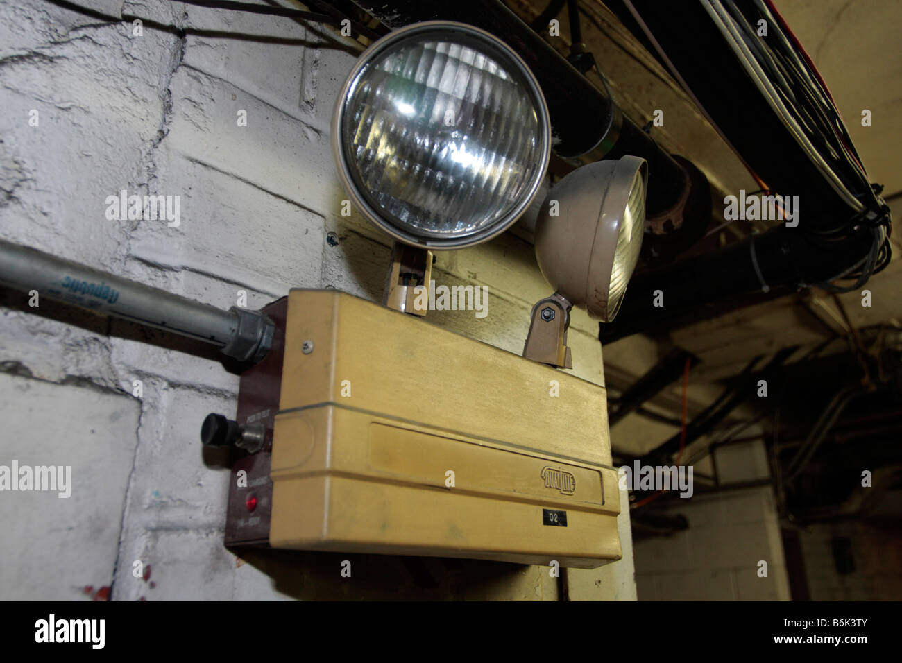 Battery powered emergency lights pointing two directions Stock Photo