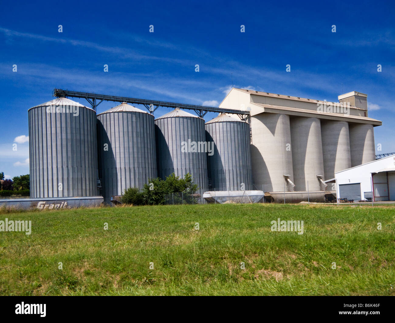 Steel and concrete industrial grain silos in southwest France Europe Stock Photo